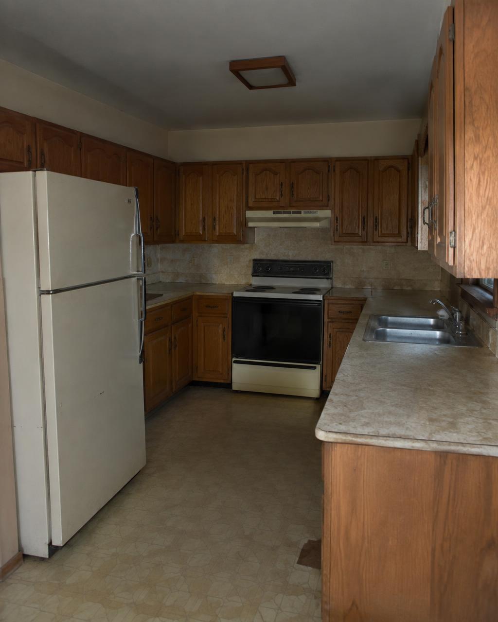 Dated kitchen transformed into a bright modern space before renovation